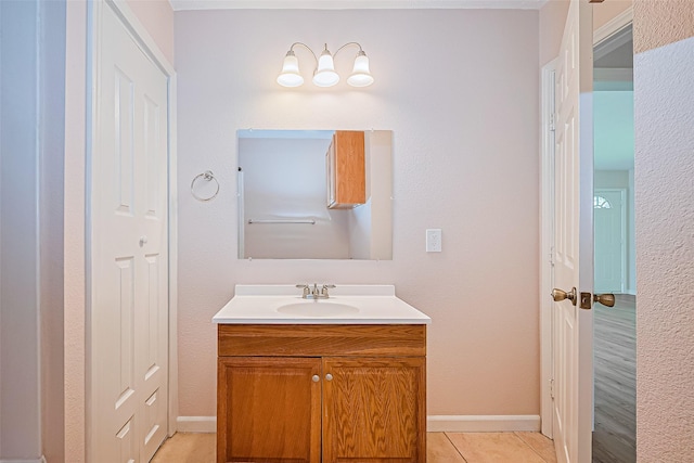 115 N 12th St, Highlands, TX 77562 - bathroom featuring vanity, tile patterned flooring, and baseboards