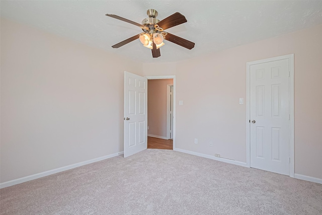115 N 12th St, Highlands, TX 77562 - unfurnished room featuring carpet flooring, ceiling fan, and baseboards