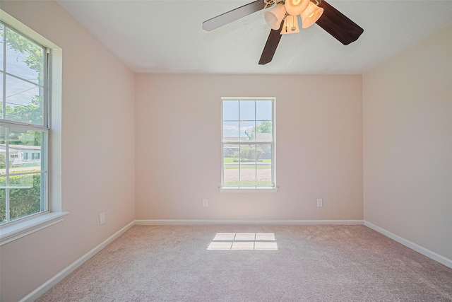 115 N 12th St, Highlands, TX 77562 - unfurnished room with plenty of natural light, carpet, and baseboards
