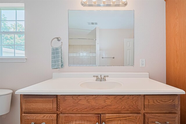 115 N 12th St, Highlands, TX 77562 - bathroom with vanity and toilet