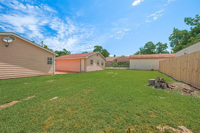 115 N 12th St, Highlands, TX 77562 - view of yard featuring an outbuilding