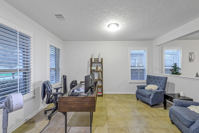 28614 Cabrera Hill Ln, Katy, TX 77494 - office area featuring a textured ceiling and baseboards