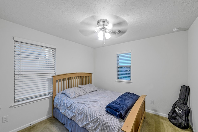 28614 Cabrera Hill Ln, Katy, TX 77494 - bedroom featuring carpet, baseboards, ceiling fan, and a textured ceiling