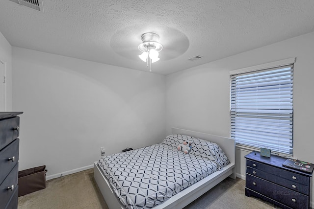 28614 Cabrera Hill Ln, Katy, TX 77494 - bedroom featuring carpet flooring, a textured ceiling, baseboards, and ceiling fan
