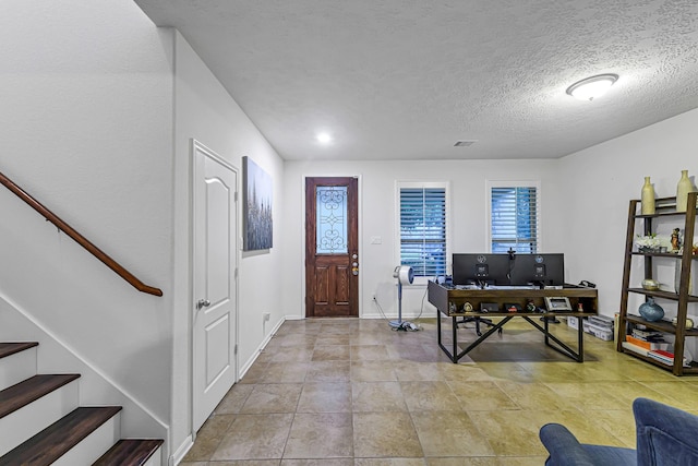 28614 Cabrera Hill Ln, Katy, TX 77494 - entrance foyer with stairs, baseboards, and a textured ceiling