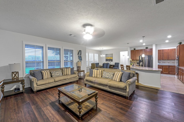 28614 Cabrera Hill Ln, Katy, TX 77494 - living area with a ceiling fan, a textured ceiling, light wood-style floors, and recessed lighting