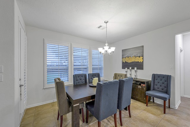 28614 Cabrera Hill Ln, Katy, TX 77494 - dining area with a chandelier, light tile patterned floors, baseboards, and a textured ceiling