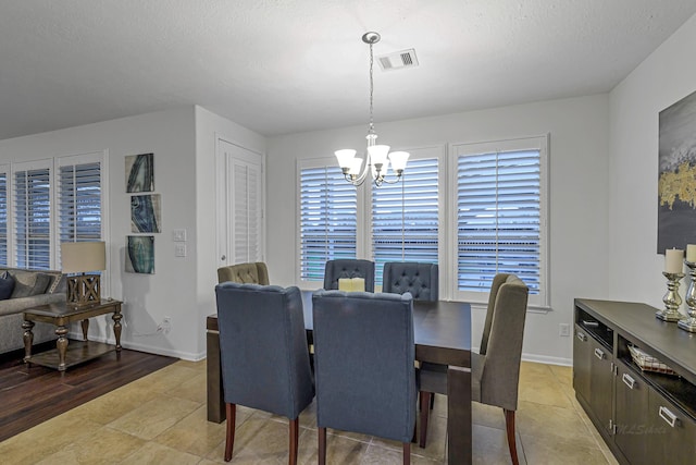 28614 Cabrera Hill Ln, Katy, TX 77494 - dining space with a chandelier, light tile patterned floors, and baseboards