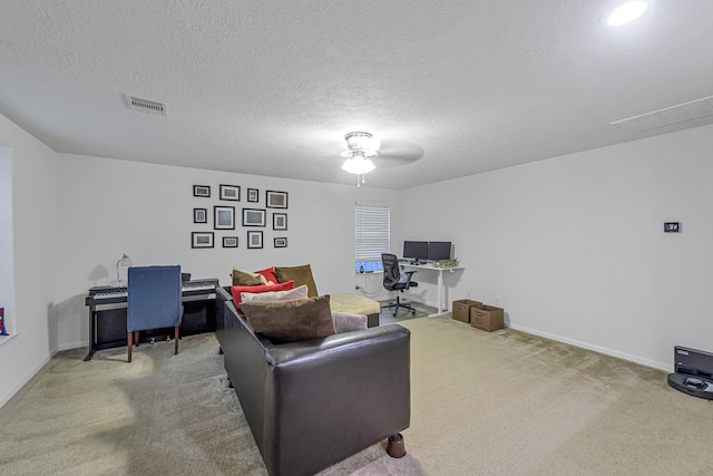 28614 Cabrera Hill Ln, Katy, TX 77494 - living area featuring carpet flooring, an office area, a ceiling fan, baseboards, and a textured ceiling