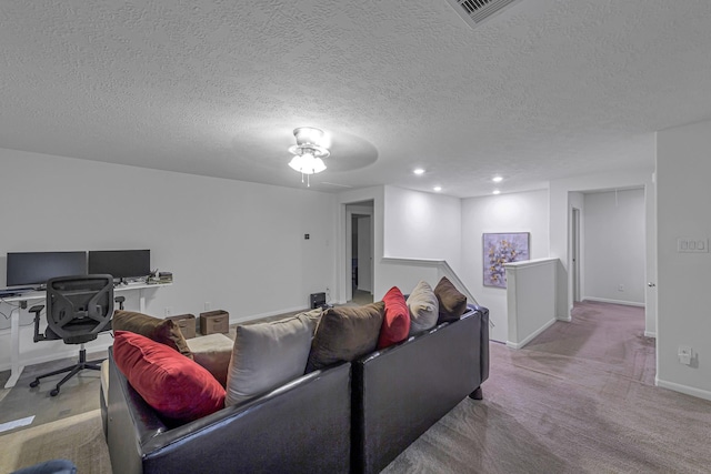 28614 Cabrera Hill Ln, Katy, TX 77494 - carpeted living room featuring a ceiling fan, baseboards, a textured ceiling, a desk, and recessed lighting
