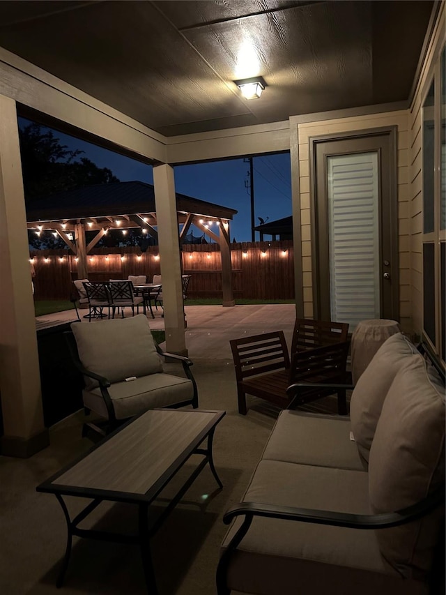 28614 Cabrera Hill Ln, Katy, TX 77494 - patio at twilight with outdoor lounge area, a patio area, a fenced backyard, and outdoor dining area