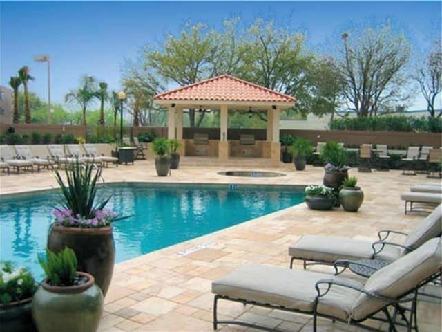 3525 Sage Rd Unit 412, Houston, TX 77056 - view of swimming pool featuring a gazebo, a patio, and an in-ground hot tub