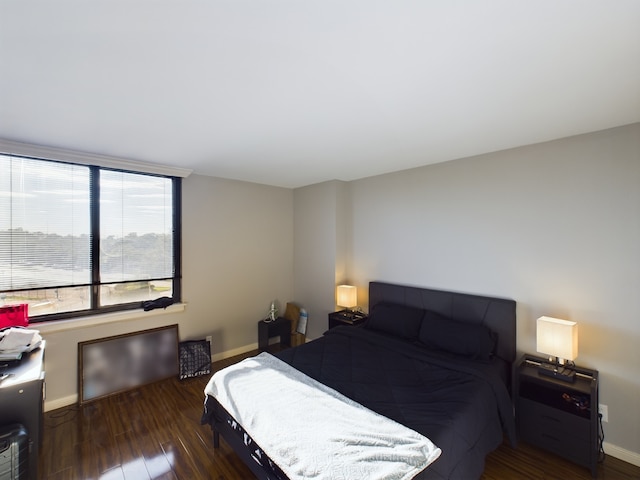 3525 Sage Rd Unit 403, Houston, TX 77056 - bedroom featuring wood finished floors and baseboards