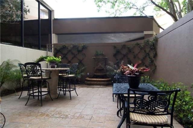 3525 Sage Rd Unit 403, Houston, TX 77056 - view of patio featuring outdoor dining space