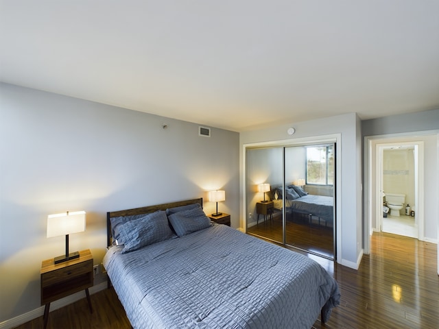 3525 Sage Rd Unit 403, Houston, TX 77056 - bedroom with wood finished floors, a closet, and baseboards