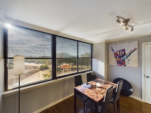 3525 Sage Rd Unit 403, Houston, TX 77056 - dining space featuring baseboards and wood finished floors