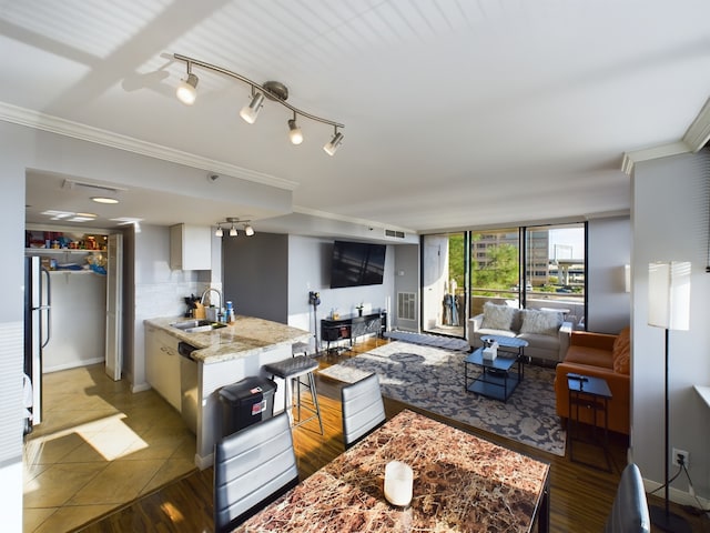 3525 Sage Rd Unit 403, Houston, TX 77056 - kitchen with a sink, open floor plan, crown molding, dishwasher, and light stone countertops