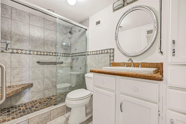 2016 Main St Unit 620, Houston, TX 77002 - bathroom featuring toilet, a stall shower, and vanity