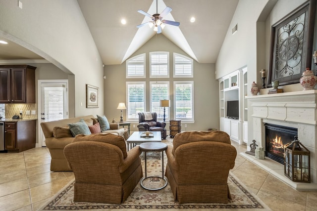 4611 Kings Landing Ln, Katy, TX 77494 - living room with a ceiling fan, a premium fireplace, arched walkways, light tile patterned floors, and recessed lighting