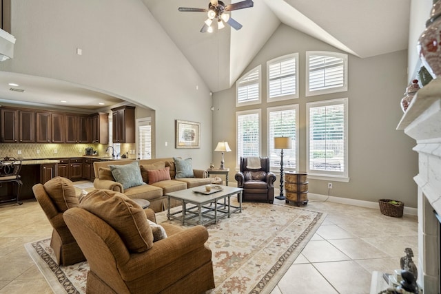 4611 Kings Landing Ln, Katy, TX 77494 - living room featuring plenty of natural light, ceiling fan, arched walkways, light tile patterned floors, and high vaulted ceiling