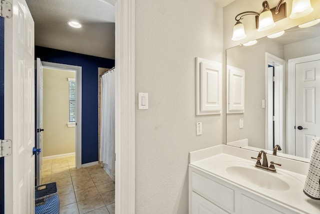 4611 Kings Landing Ln, Katy, TX 77494 - full bath featuring vanity, tile patterned flooring, baseboards, and a shower with shower curtain