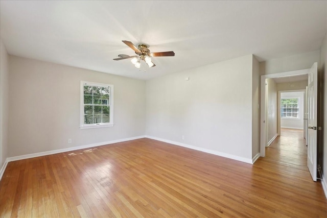 1175 N 23rd St, Beaumont, TX 77706 - spare room featuring light wood finished floors, baseboards, and a ceiling fan