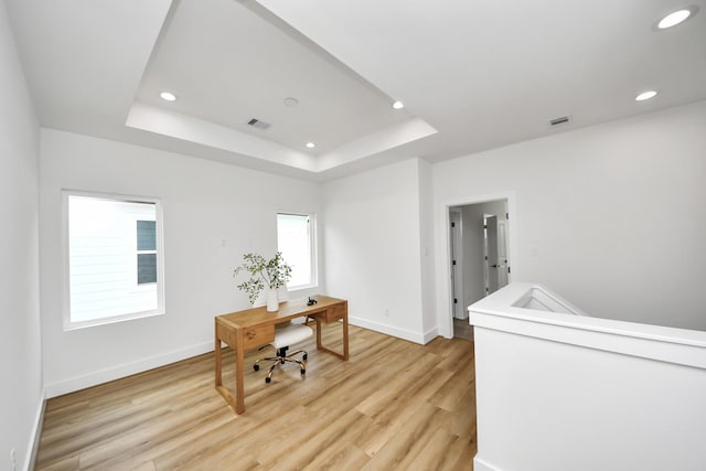 4602 Bristol St, Houston, TX 77009 - office featuring light wood-style flooring, a tray ceiling, baseboards, and recessed lighting