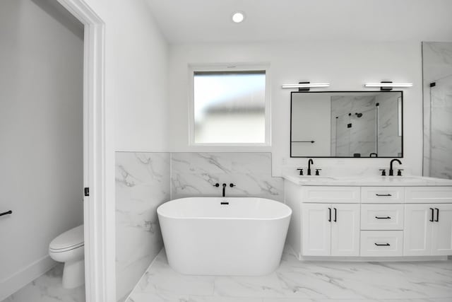 4602 Bristol St, Houston, TX 77009 - full bathroom featuring marble finish flooring, a freestanding tub, double vanity, a marble finish shower, and toilet