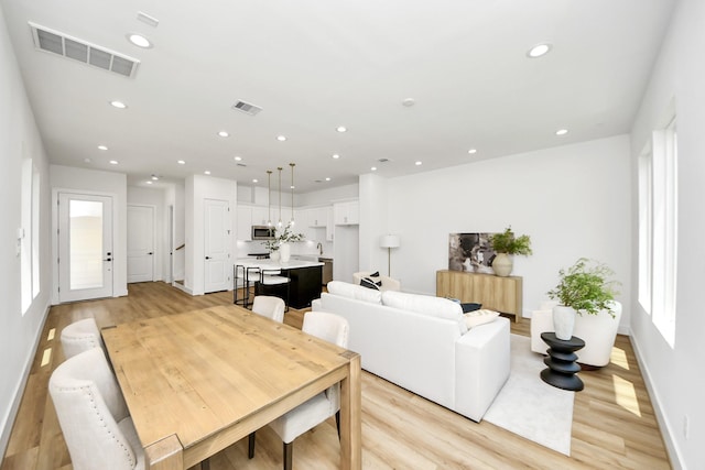 4602 Bristol St, Houston, TX 77009 - dining room with light wood-style floors, recessed lighting, and baseboards