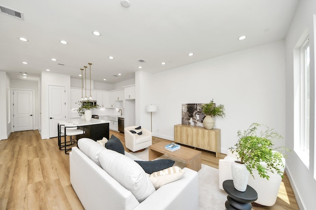 4602 Bristol St, Houston, TX 77009 - living area featuring recessed lighting, light wood-style flooring, and baseboards