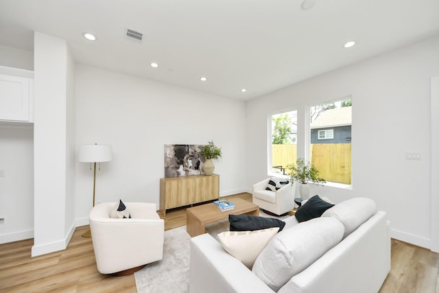 4602 Bristol St, Houston, TX 77009 - living area featuring light wood finished floors, recessed lighting, and baseboards
