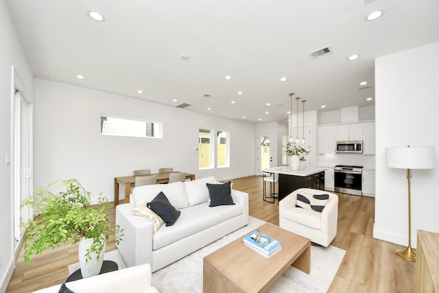 4602 Bristol St, Houston, TX 77009 - living room with light wood-style floors, recessed lighting, and baseboards