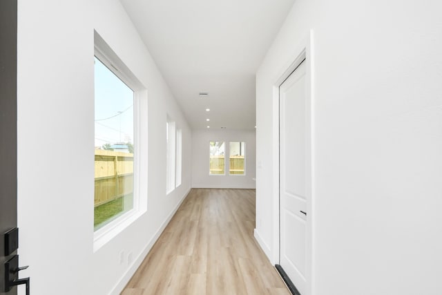 103 Frawley St, Houston, TX 77009 - hallway with light wood-style floors, baseboards, and recessed lighting