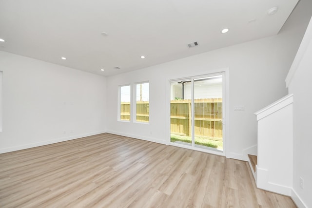 103 Frawley St, Houston, TX 77009 - empty room with light wood finished floors, recessed lighting, and baseboards