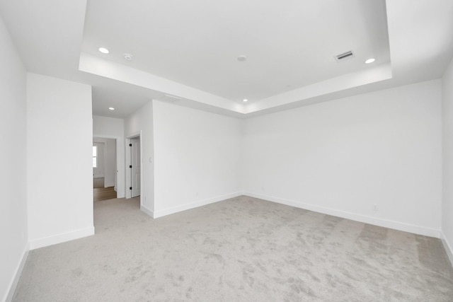103 Frawley St, Houston, TX 77009 - unfurnished room with recessed lighting, a tray ceiling, light carpet, and baseboards