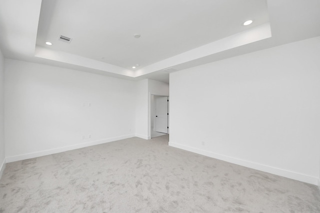 103 Frawley St, Houston, TX 77009 - empty room featuring a tray ceiling, baseboards, recessed lighting, and carpet flooring
