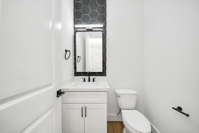 103 Frawley St, Houston, TX 77009 - bathroom featuring toilet, vanity, and wood finished floors