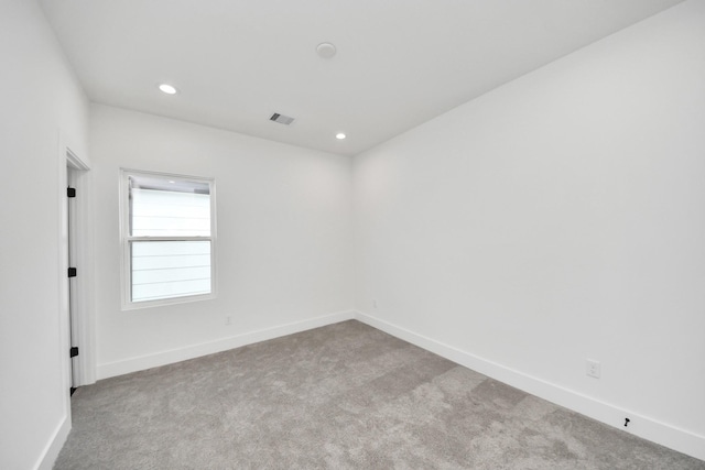 103 Frawley St, Houston, TX 77009 - spare room with carpet flooring, baseboards, and recessed lighting