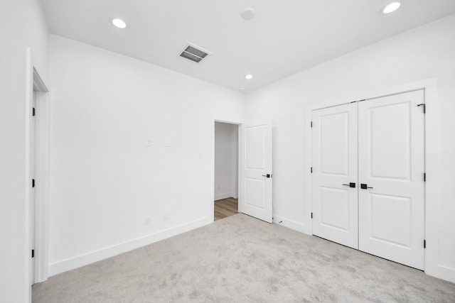 103 Frawley St, Houston, TX 77009 - unfurnished bedroom featuring carpet flooring, recessed lighting, baseboards, and a closet