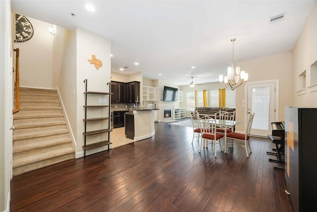 5142 Oasis Park, Houston, TX 77021 - dining area with hardwood / wood-style floors, stairway, baseboards, recessed lighting, and a chandelier