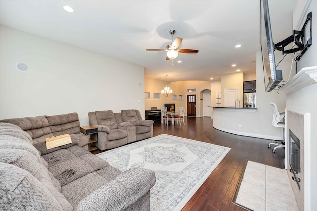 5142 Oasis Park, Houston, TX 77021 - living room featuring arched walkways, dark wood-style floors, ceiling fan, a chandelier, and recessed lighting