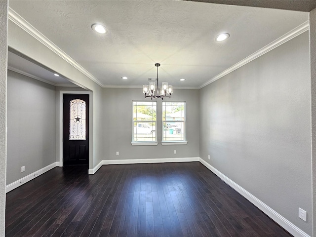 4319 Trail Lake Dr, Houston, TX 77045 - entrance foyer featuring a chandelier, dark wood-style floors, baseboards, recessed lighting, and crown molding