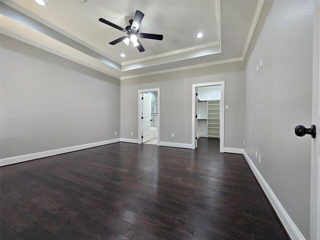 4319 Trail Lake Dr, Houston, TX 77045 - spare room with dark wood finished floors, a tray ceiling, ceiling fan, ornamental molding, and baseboards