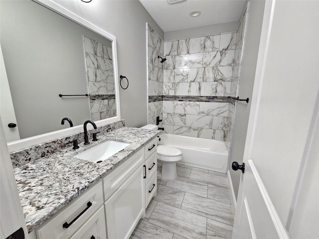 4319 Trail Lake Dr, Houston, TX 77045 - full bathroom featuring vanity, toilet, marble look tile flooring, and shower / washtub combination