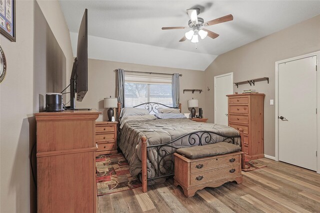 739 Apple Blossom Dr, Pearland, TX 77584 - bedroom with light wood-type flooring, lofted ceiling, and a ceiling fan