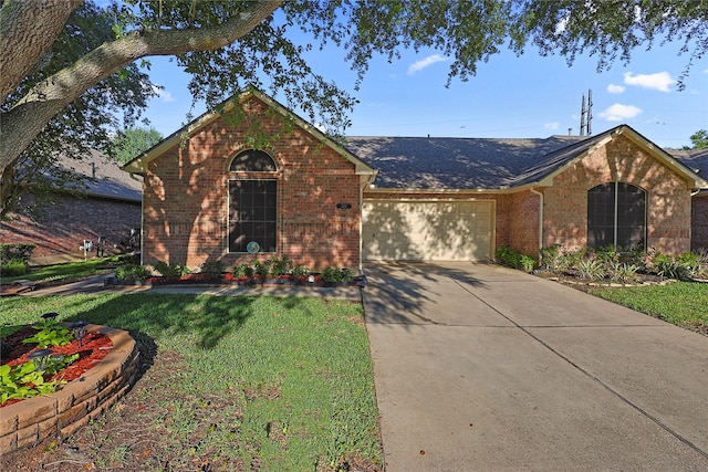739 Apple Blossom Dr, Pearland, TX 77584 - view of front of home featuring brick siding, an attached garage, driveway, and a front yard