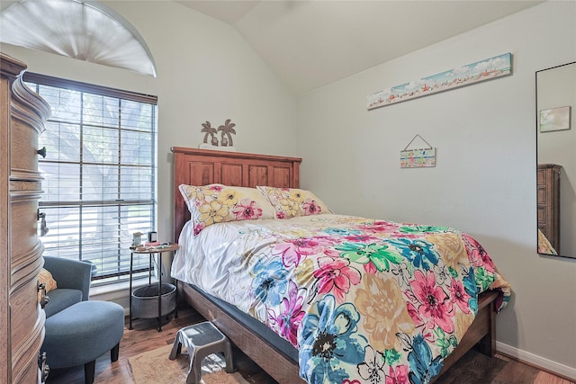 739 Apple Blossom Dr, Pearland, TX 77584 - bedroom with multiple windows, wood finished floors, lofted ceiling, and baseboards