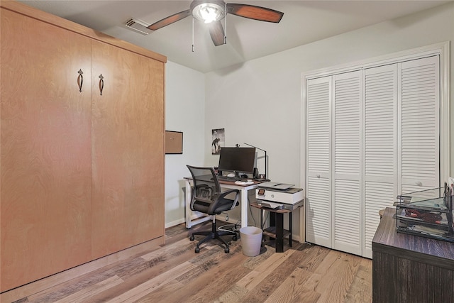 739 Apple Blossom Dr, Pearland, TX 77584 - home office featuring light wood finished floors, ceiling fan, and baseboards