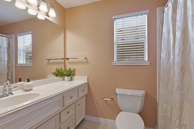 2913 Jackson St, Houston, TX 77004 - full bathroom featuring vanity, toilet, tile patterned floors, baseboards, and a shower with curtain