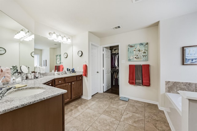 4223 Leafy Bough Ct, Humble, TX 77346 - full bath with vanity, a garden tub, tile patterned floors, and baseboards